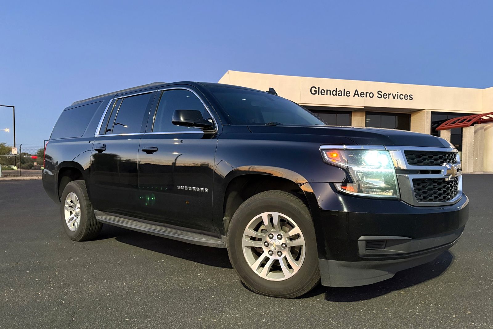 Black Chevrolet Suburban parked outside Glendale Aero Services at Glendale Airport (GEU)