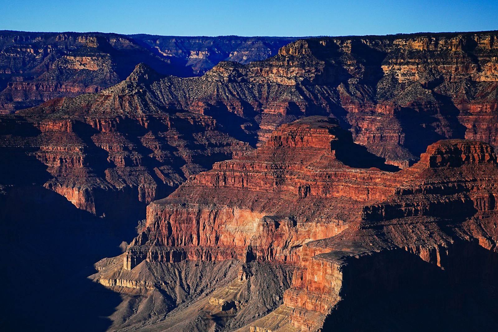 Grand Canyon cliffs and rock layers at golden hour